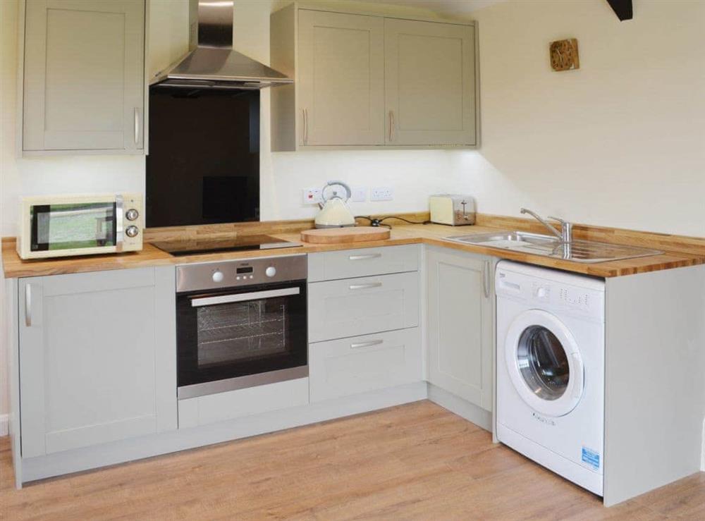 Fully fitted and well equipped kitchen at Saddlers Cottage, 