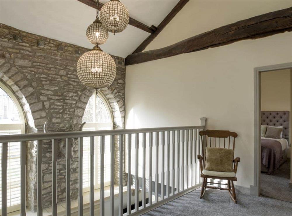 First floor landing with high ceiling revealing exposed wood beams at Old Chapel House in Barnoldswick, Lancashire