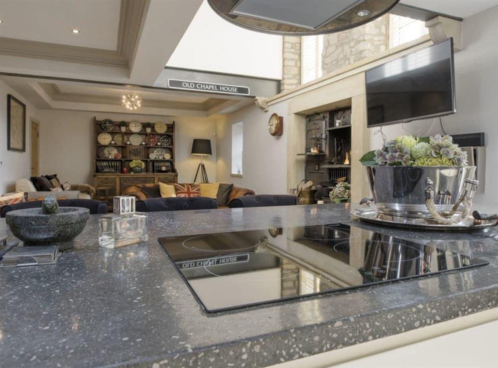 Looking over the kitchen island to the open plan living spaces at Old Chapel House in Barnoldswick, Lancashire