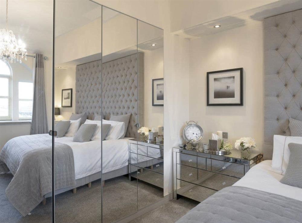 Mirrored storage within master bedroom at Old Chapel House in Barnoldswick, Lancashire