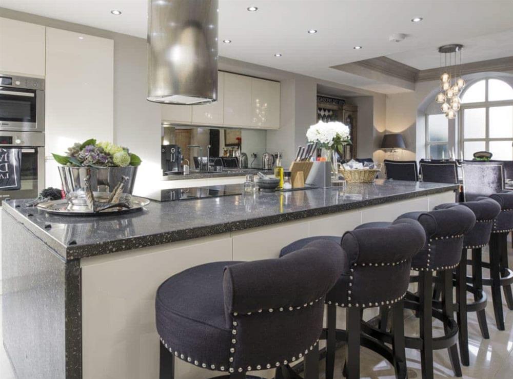 Well-equipped kitchen area with breakfast bar at Old Chapel House in Barnoldswick, Lancashire