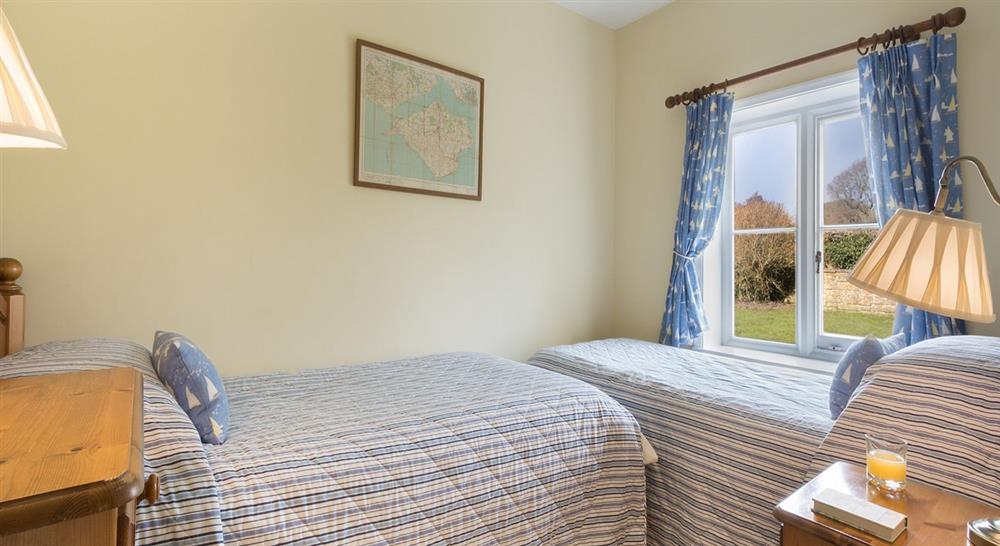 The twin bedroom at Old Church Lodge in Isle Of Wight, Isle Of Wight