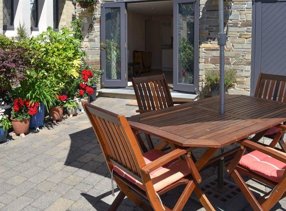 Patio area with outdoor furniture at Old Church School in Plympton, near Plymouth, Devon