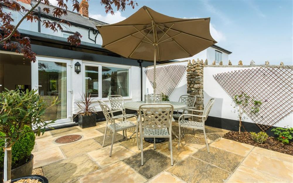 Private patio area with furniture for dining  at Old Cider Press in Colyton