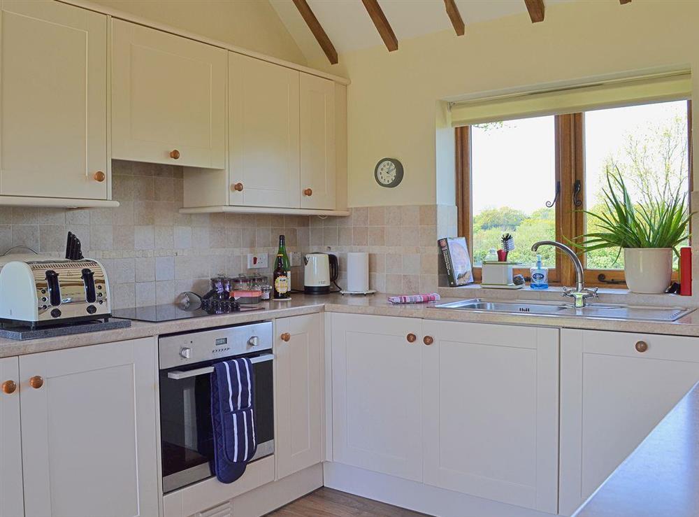 The bright and airy kitchen at Old Dairy Barn in Playden, near Rye, East Sussex