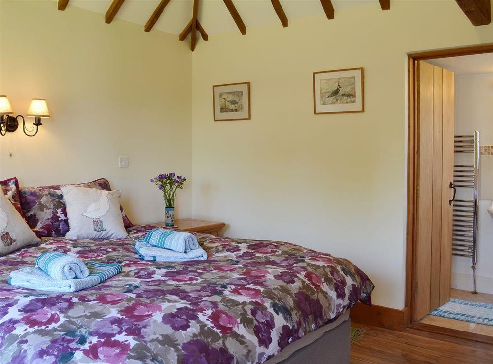 The third, beamed bedroom can be either a super kingsize double or twin bedroom and has an en-suite shower room at Old Dairy Barn in Playden, near Rye, East Sussex