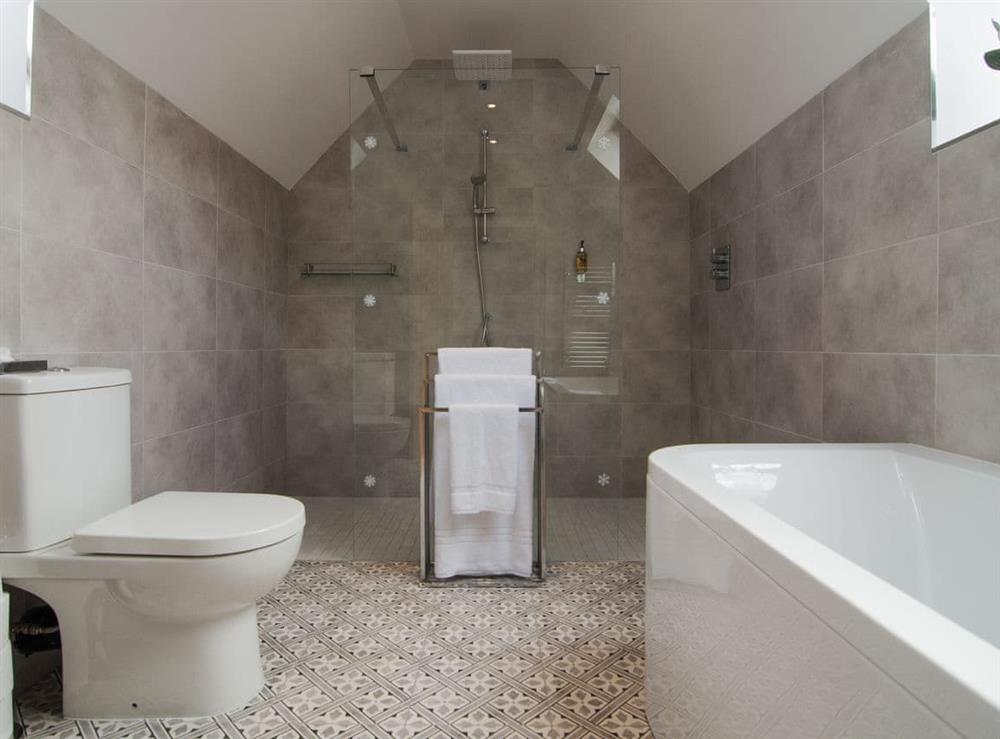 Bathroom with walk-in shower at The Coach House, 