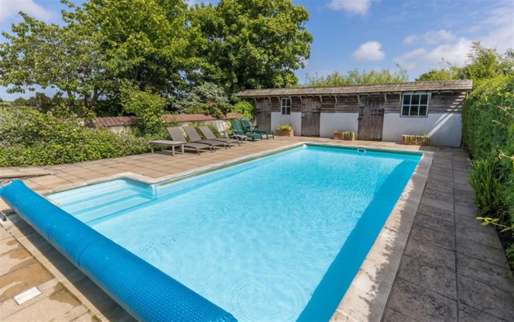 Enjoy the swimming pool at Old Farm Cottage in Pilley