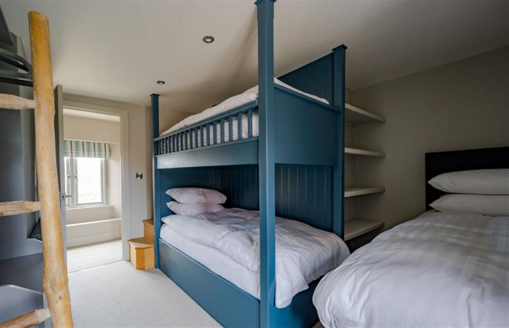 First floor: Bedroom five, triple bedroom with bunk beds and single bed at Old Farm, Thornham near Hunstanton