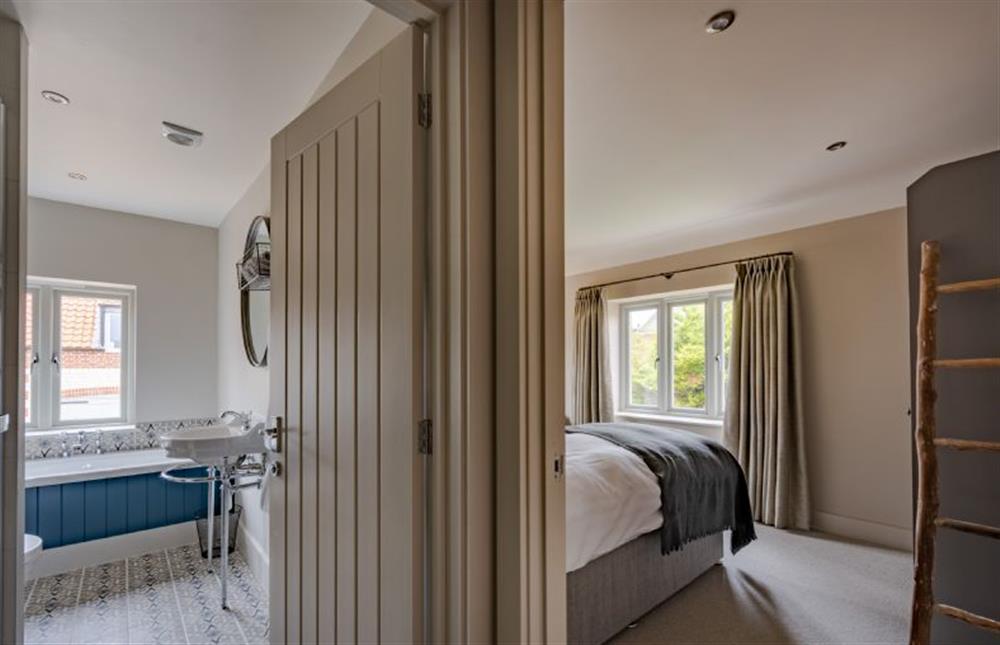 First floor: Bedroom four, twin room with en-suite at Old Farm, Thornham near Hunstanton