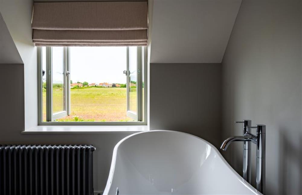 First floor: Bedroom three with freestanding bath and great views! at Old Farm, Thornham near Hunstanton