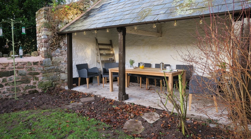 The outdoor seating area at Old Gateway Cottage in Minehead, Somerset