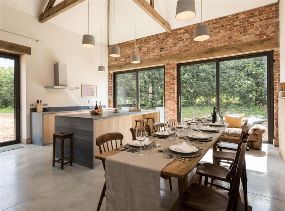 open plan kitchen/diner with patio doors at Old Hall Farm Barn in Kerdiston, near Norwich, Norfolk