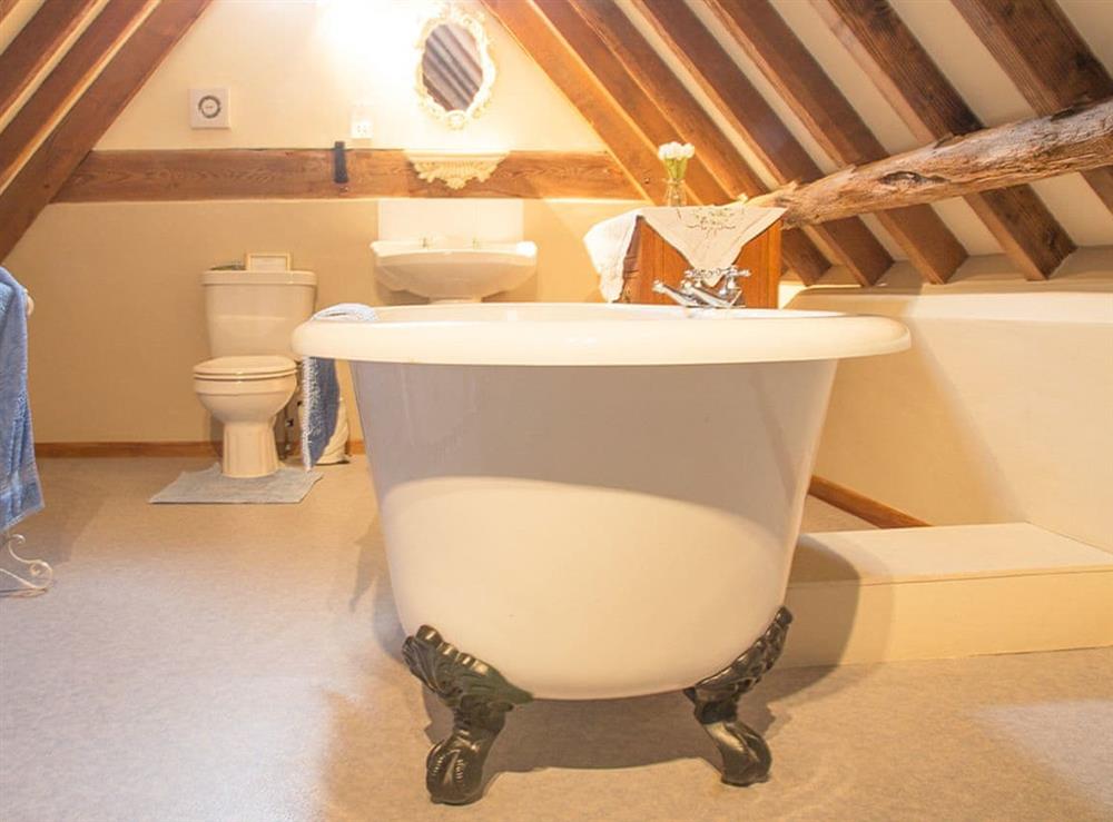 Charming bathroom with free-standing roll top bath at Old Corn Mill, 