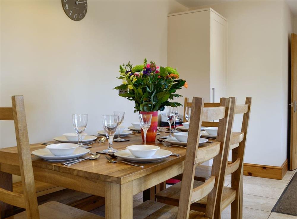 Convenient dining area within kitchen at King Offa Lodge, 