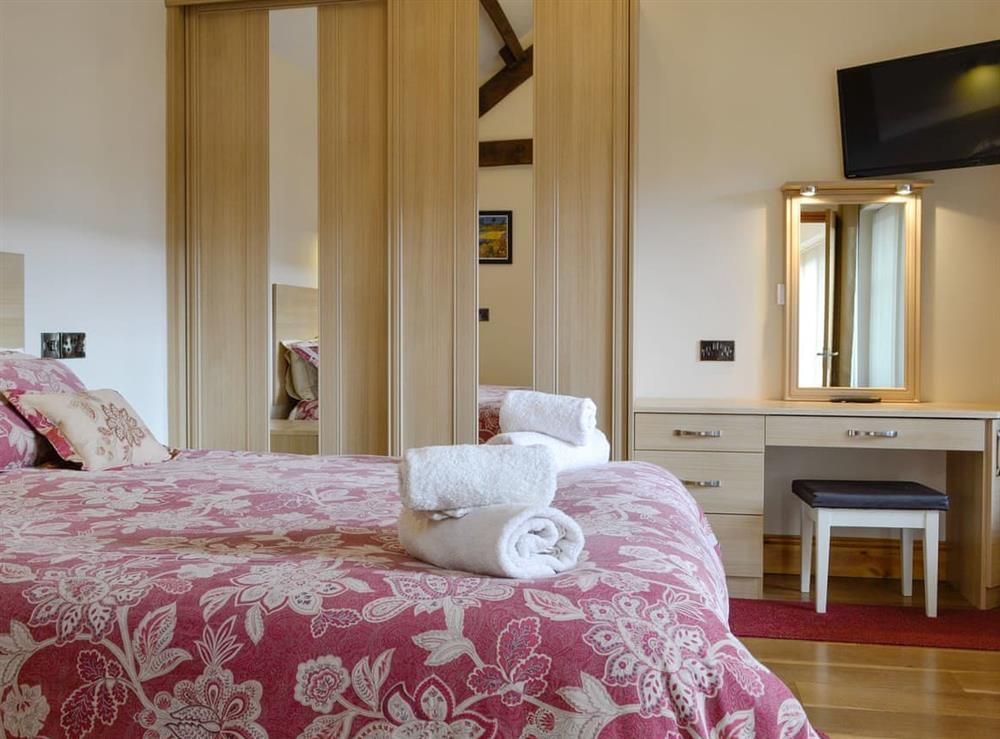 Peaceful double bedroom at Little Hendre Lodge, 