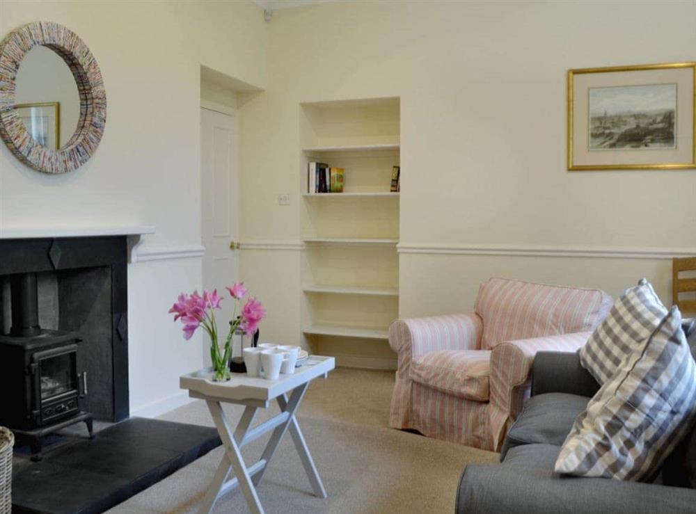 Spacious living/dining room with woodburner at Fernwoodlea, 
