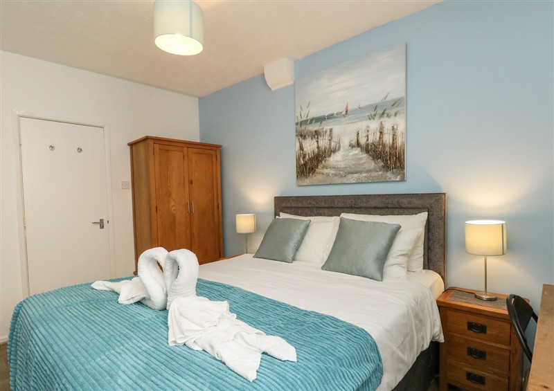 A bedroom in Old Malthouse Apartment at Old Malthouse Apartment, Weymouth