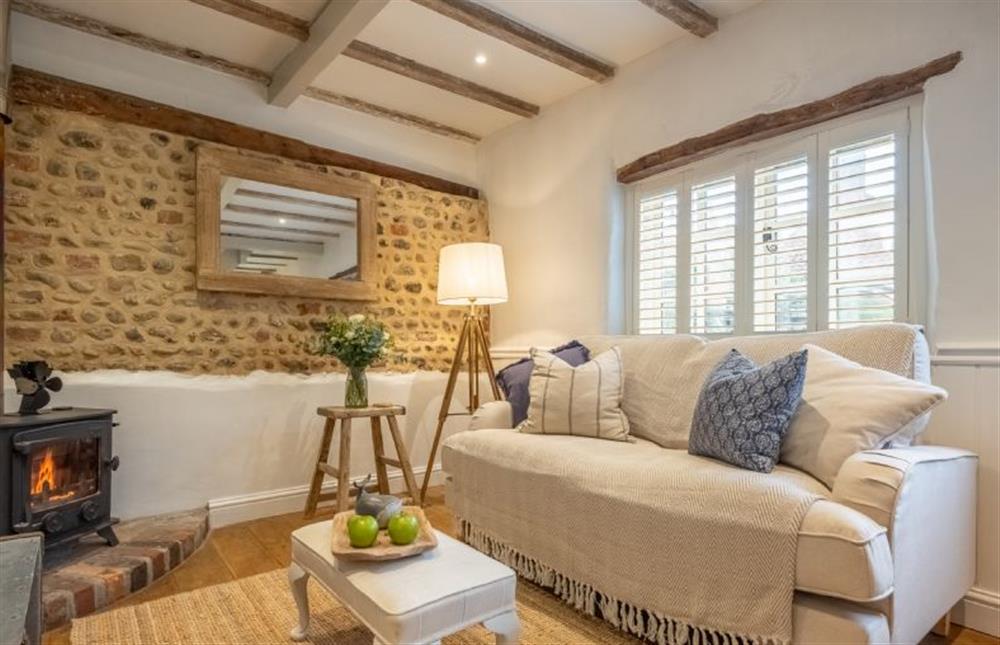 Characterful sitting room with cosy wood burning stove