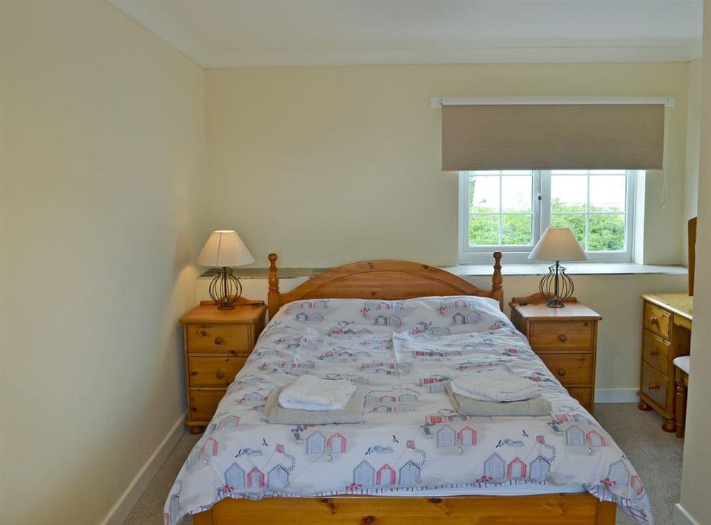 Charming double bedroom at Old Mill Cottage in Cemaes Bay, Gwynedd