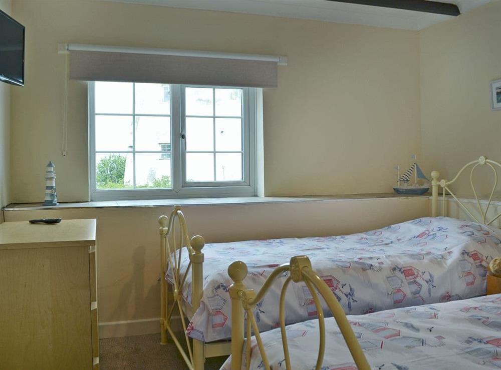 Comfy twin bedroom at Old Mill Cottage in Cemaes Bay, Gwynedd