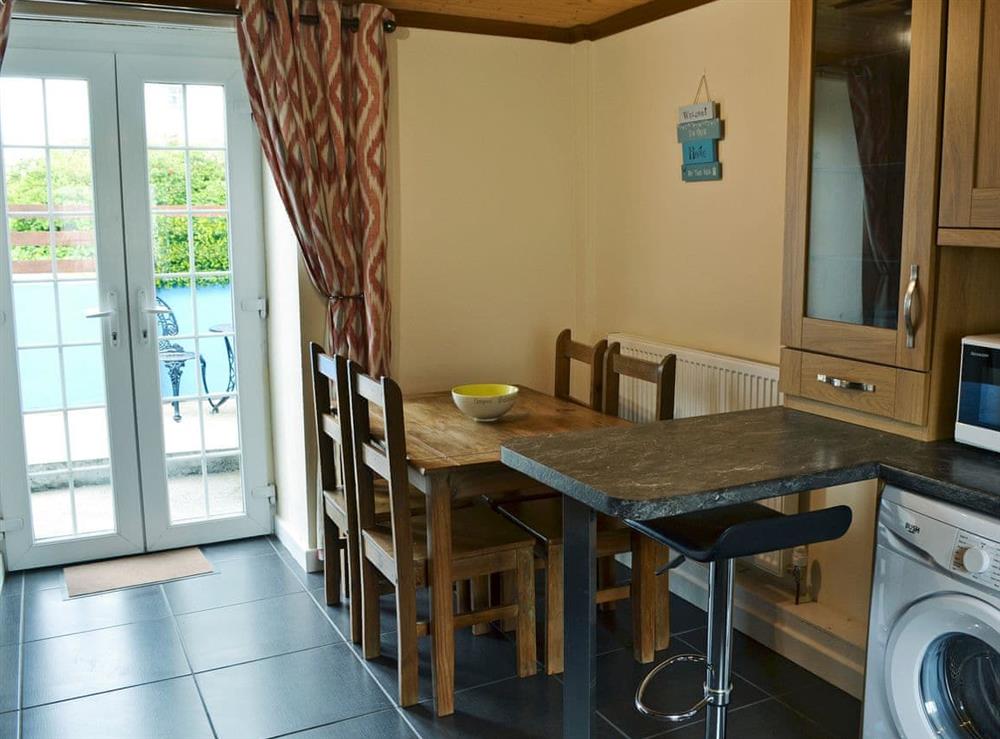 Inviting dining area at Old Mill Cottage in Cemaes Bay, Gwynedd