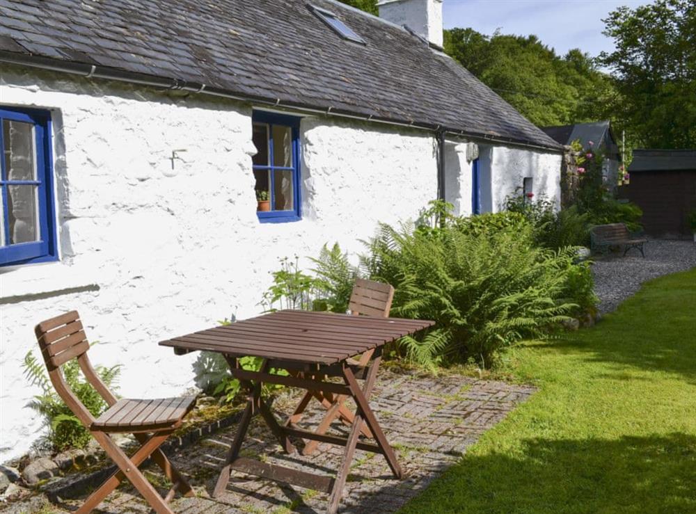 Enclosed lawned garden with sitting-out area, garden furniture and BBQ (photo 2) at Old Mill Cottage in Duror, near Appin, Highlands, Argyll