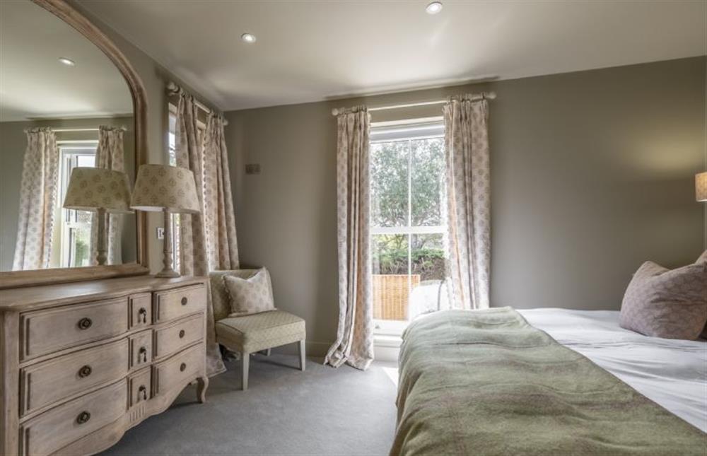 Dual aspect master bedroom at Old Mill House, Brancaster near Kings Lynn