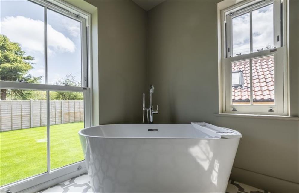 Master en-suite with double ended bath tub at Old Mill House, Brancaster near Kings Lynn