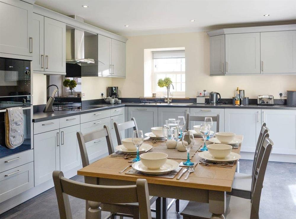 Fully appointed fitted kitchen with dining area at The Stables, 