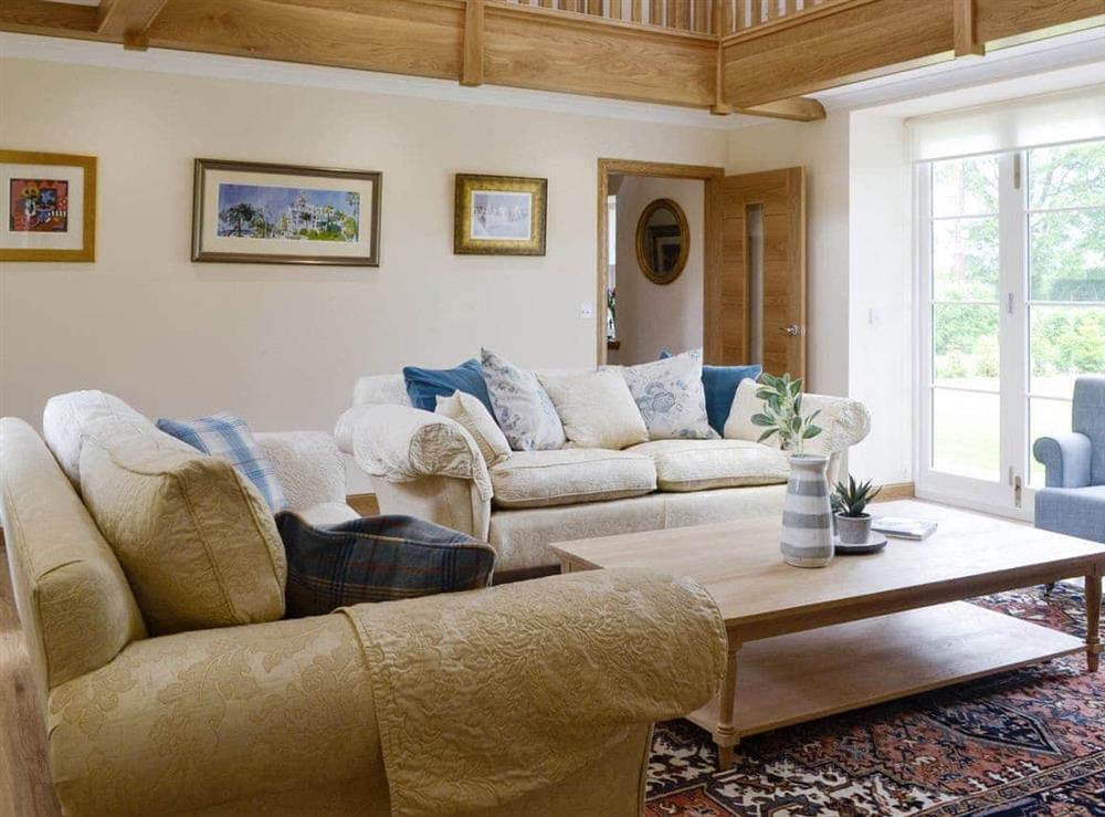 Spacious living room with galleried landing at The Stables, 