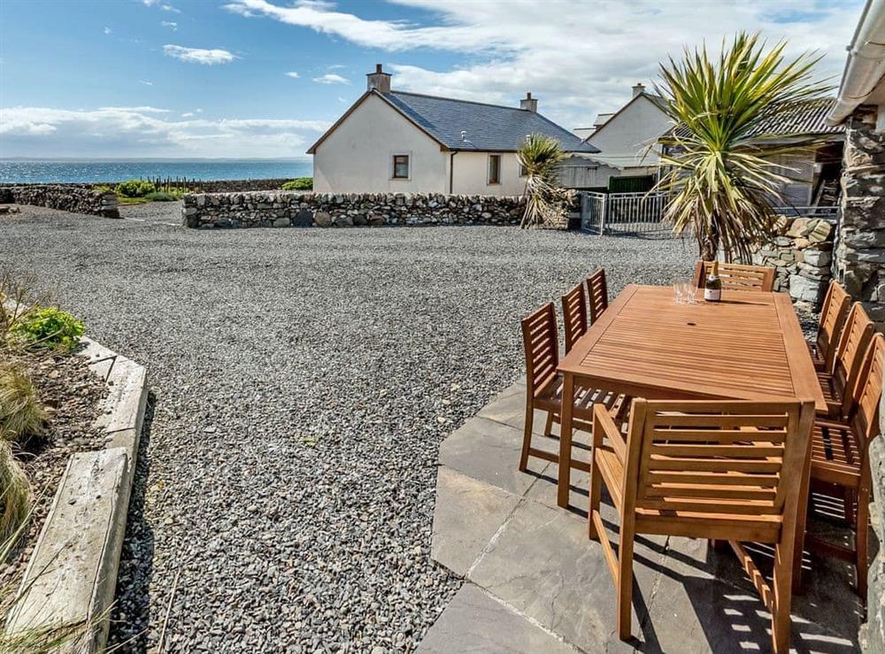 Enjoy the wonderful views from the sitting-out-area at Old Port Store in Stairhaven, near Newton Stewart, Wigtownshire