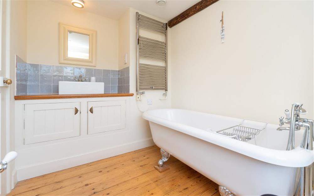 The master en suite with roll top bath at Old Post Office in Stokenham