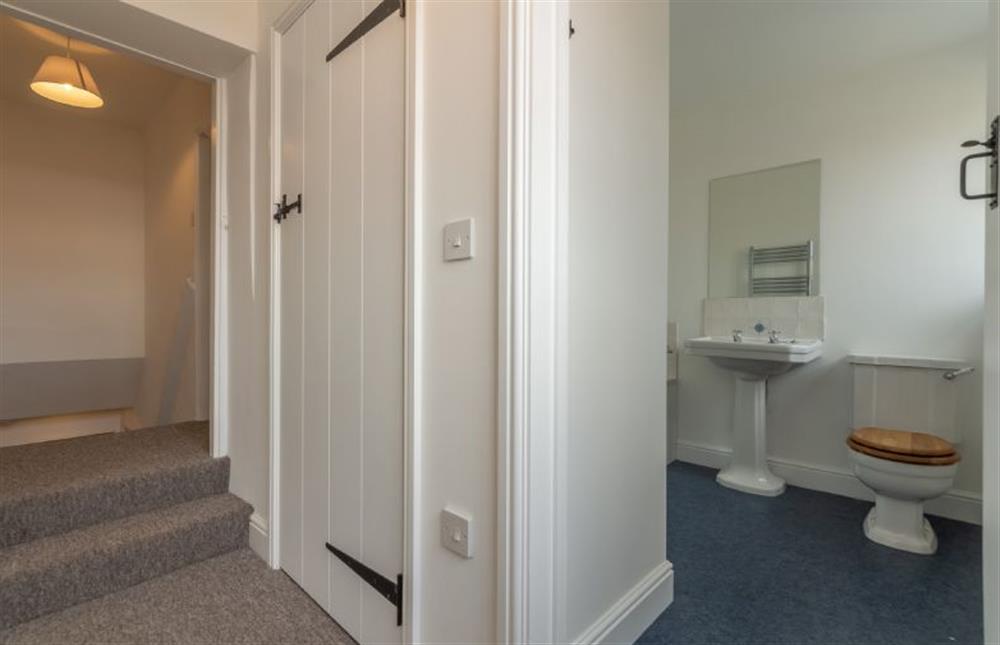 First floor: Steps down from the landing to twin room and bathroom at Old Posting, Brancaster Staithe near Kings Lynn