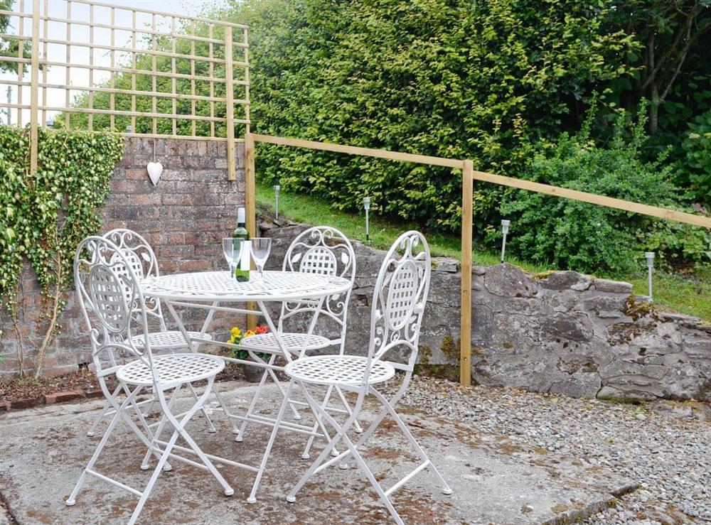 Patio area with outdoor furniture at Old School Cottage in Kettins, near Blairgowrie, Perthshire