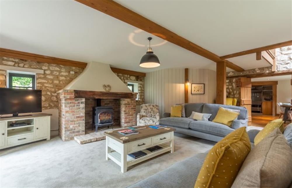 Ground Floor: Sitting room featuring a wood burning stove