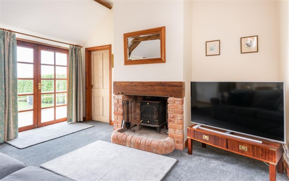 Enjoy the living room at Old Stable Cottage in Seaton