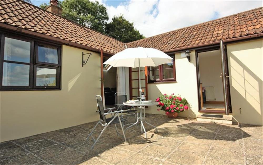 Enjoy the patio area  at Old Stable Cottage in Seaton