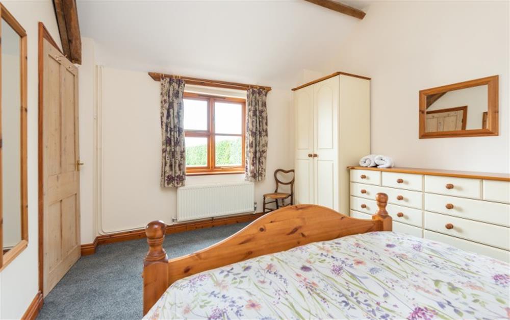 This is a bedroom at Old Stable Cottage in Seaton