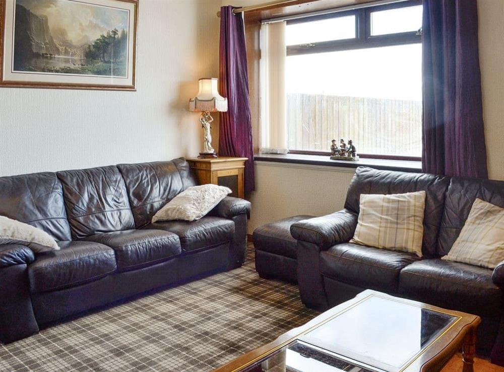 Spacious living room at Old Stable Cottage in Uplawmoor, near Barrhead, Lanarkshire