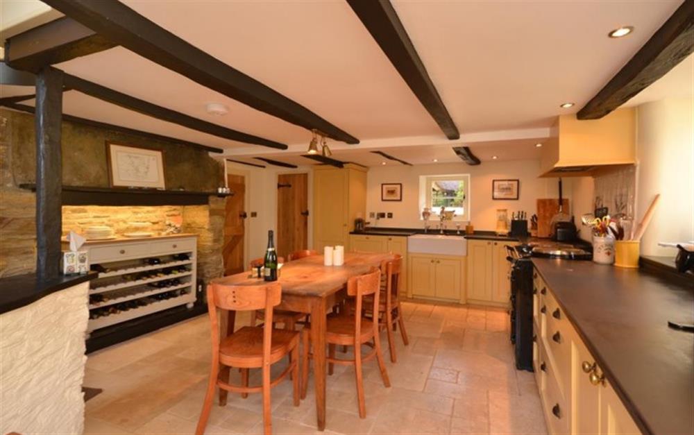 The large kitchen diner with exposed beams at Old Thatch in Torcross