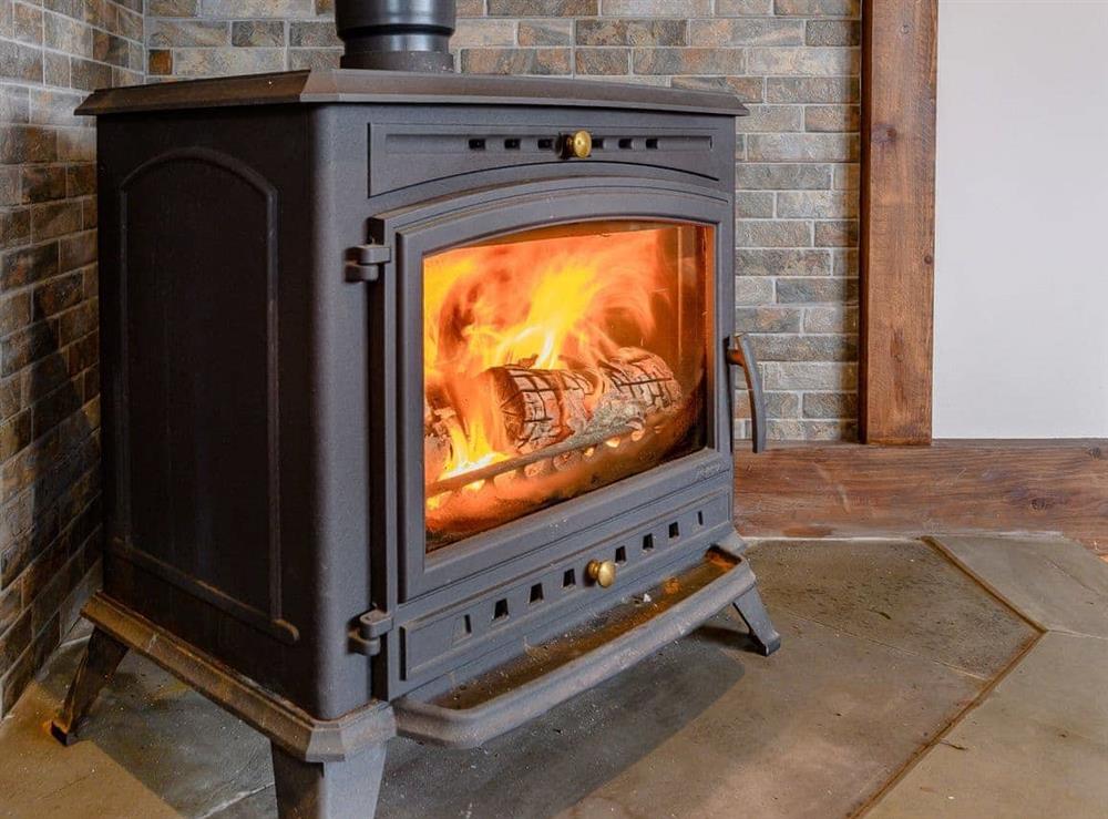 Warming wood burner at Olive Lodge in Melbourne, near Derby, Derbyshire