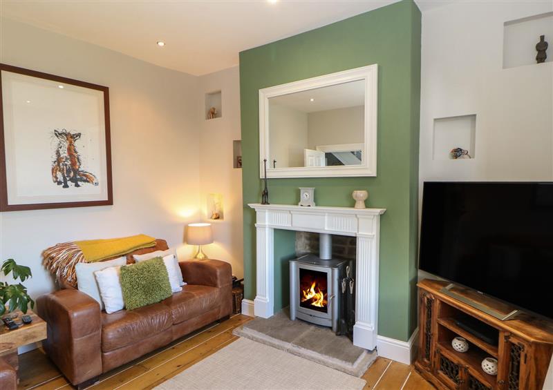 Relax in the living area at Olive Tree Cottage, Honley