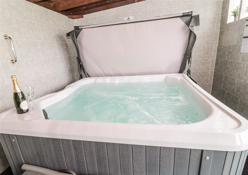Relax in the hot tub at On The Watersedge, Beadnell