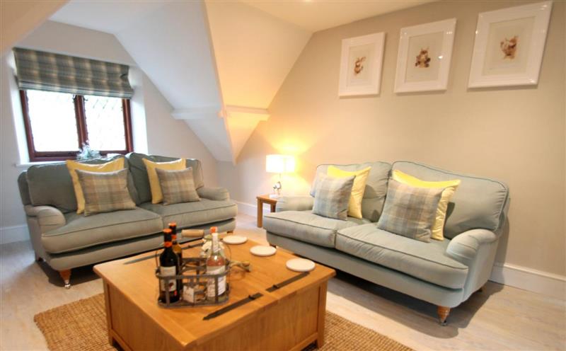The living area at One Grooms Cottage, Dunster