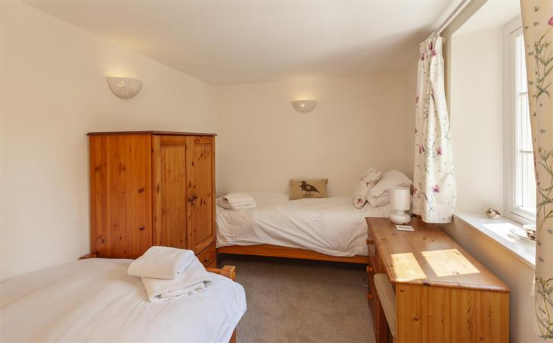 A bedroom in One Lower Spire Cottage at One Lower Spire Cottage, Nr Dulverton
