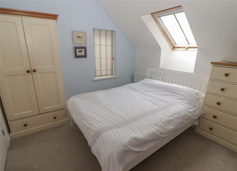This is a bedroom at One Tree House, Dinas Cross