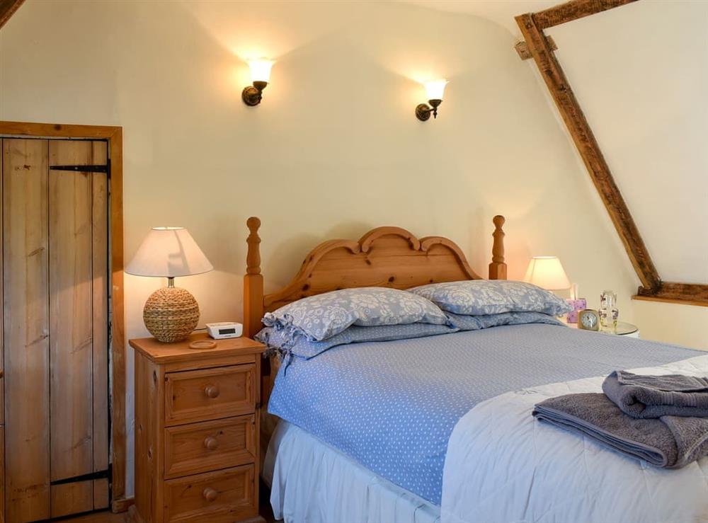 Relaxing double bedroom with beams (photo 2) at One Well Cottage in Holton, near Halesworth, Suffolk