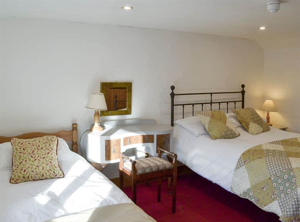 Airy triple bedroom with one double and one single bed at Orchard Barn in Bampton, near Tiverton, Devon