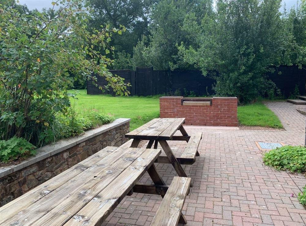Outdoor seating area at Orchard Barn in Bampton, near Tiverton, Devon
